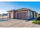 House exterior with two car garage and landscaping at 12535 Valentia St, Brighton, CO 80602