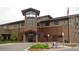 Community building exterior with stone and wood siding at 13890 E Marina Dr # 111, Aurora, CO 80014
