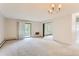 Bright living room with access to balcony and view to neighboring building at 13890 E Marina Dr # 111, Aurora, CO 80014