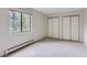 Bedroom with double closets and window at 13890 E Marina Dr # 111, Aurora, CO 80014