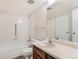 Bathroom with shower/tub combo and wood vanity at 13890 E Marina Dr # 111, Aurora, CO 80014