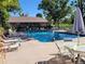Community pool with lounge chairs and patio tables at 13890 E Marina Dr # 111, Aurora, CO 80014