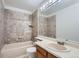 Bathroom features beige tile, a tub, and a vanity at 4675 S Dillon Ct # H112, Aurora, CO 80015