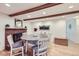 Cozy dining room with a brick fireplace and hardwood floors at 1761 S Estes, Lakewood, CO 80232