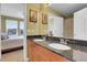 Bathroom with granite countertops and double sinks at 23043 Cleveland Dr, Parker, CO 80138