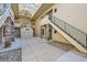 Shared courtyard with brick columns and a staircase at 8767 E Dry Creek Rd # 1312, Englewood, CO 80112