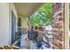 Relaxing patio with brick walls and potted plants at 8767 E Dry Creek Rd # 1312, Englewood, CO 80112