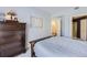 Guest bedroom with dresser, full bed, and access to a shared bathroom at 8767 E Dry Creek Rd # 1312, Englewood, CO 80112