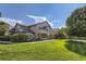 Two-story building with manicured lawn and walkway at 8767 E Dry Creek Rd # 1312, Englewood, CO 80112