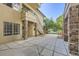 Courtyard entrance with brick columns and a staircase at 8767 E Dry Creek Rd # 1312, Englewood, CO 80112