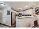 Spacious kitchen with stainless steel appliances and a breakfast bar at 8767 E Dry Creek Rd # 1312, Englewood, CO 80112