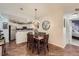 Bright dining room with hardwood floors and kitchen views at 8767 E Dry Creek Rd # 1312, Englewood, CO 80112