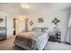 Main bedroom with a gray bed frame and a view into the bathroom at 1155 N Ash St # 1504, Denver, CO 80220