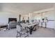 Bright dining area with marble table and seating for four, adjacent to living area at 1155 N Ash St # 1504, Denver, CO 80220