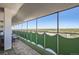 Spacious balcony with city views and green privacy screens at 1155 N Ash St # 1504, Denver, CO 80220