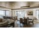 Open concept dining room with city views and modern chandelier at 1133 14Th St # 3220, Denver, CO 80202