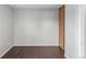 Simple bedroom with dark laminate floors and closet at 1653 S Blackhawk Way # B, Aurora, CO 80012