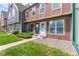 Neatly landscaped townhouse exterior with a walkway at 1653 S Blackhawk Way # B, Aurora, CO 80012