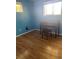 Simple bedroom with hardwood floors and blue walls at 542 E Caley Dr, Centennial, CO 80121