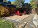 Landscaped backyard with fire pit, seating, and stone pathways at 542 E Caley Dr, Centennial, CO 80121