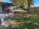 Large backyard with hot tub, patio, and mature trees at 542 E Caley Dr, Centennial, CO 80121