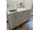 Laundry room with Whirlpool washer and dryer at 542 E Caley Dr, Centennial, CO 80121