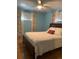 Bedroom with hardwood floors and light blue walls at 542 E Caley Dr, Centennial, CO 80121