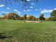Baseball field with grassy area and autumn trees at 542 E Caley Dr, Centennial, CO 80121