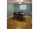 Dining room with hardwood floors and a table with four chairs at 542 E Caley Dr, Centennial, CO 80121