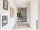 Bright hallway with hardwood floors and modern art at 1089 S Elizabeth St, Denver, CO 80209