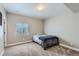 Cozy basement bedroom with neutral walls and a comfortable bed at 12689 Sunset Dr, Firestone, CO 80504