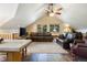 Open living room with vaulted ceiling and leather furniture at 189 Ginger Quill Ln, Breckenridge, CO 80424