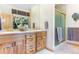 Double vanity bathroom with shower and wood cabinets at 189 Ginger Quill Ln, Breckenridge, CO 80424