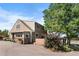 Tan stucco house with deck and landscaping at 7302 Upham Ct, Arvada, CO 80003