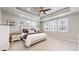 Large main bedroom with high ceilings and multiple windows at 890 Meadowlark Dr, Erie, CO 80516