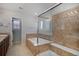 Elegant bathroom with soaking tub, shower, and double sinks at 1943 Morningview Ln, Castle Rock, CO 80109