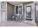 Front porch with rocking chairs and a welcoming mat at 1943 Morningview Ln, Castle Rock, CO 80109