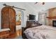 Main bedroom with large sliding barn door to bathroom at 2891 Canyon Crest Dr, Highlands Ranch, CO 80126