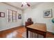 Home office with built-in desk and hardwood floors at 2891 Canyon Crest Dr, Highlands Ranch, CO 80126