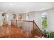 Spacious upper hallway with hardwood floors and natural light at 2891 Canyon Crest Dr, Highlands Ranch, CO 80126