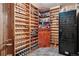 Finished basement wine cellar with extensive built-in racking at 2891 Canyon Crest Dr, Highlands Ranch, CO 80126