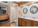Basement bathroom with double vanity and separate toilet area at 2891 Canyon Crest Dr, Highlands Ranch, CO 80126