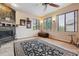 Cozy Gathering room featuring a fireplace and large windows at 2891 Canyon Crest Dr, Highlands Ranch, CO 80126