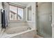 Bathroom with a soaking tub and walk-in shower at 2891 Canyon Crest Dr, Highlands Ranch, CO 80126