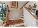 Elegant staircase with wood railing and inlay at 2891 Canyon Crest Dr, Highlands Ranch, CO 80126