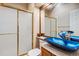 Bathroom with blue vessel sink and updated shower at 2891 Canyon Crest Dr, Highlands Ranch, CO 80126