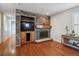 Living room with stone fireplace and built in entertainment center at 2891 Canyon Crest Dr, Highlands Ranch, CO 80126