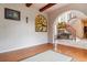 Spacious living room with hardwood floors and stained glass window at 2891 Canyon Crest Dr, Highlands Ranch, CO 80126