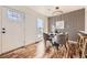 Modern dining area with wood-paneled accent wall and stylish chairs at 3110 S Halifax St, Aurora, CO 80013