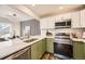 Modern kitchen with stainless steel appliances and green cabinets at 3110 S Halifax St, Aurora, CO 80013